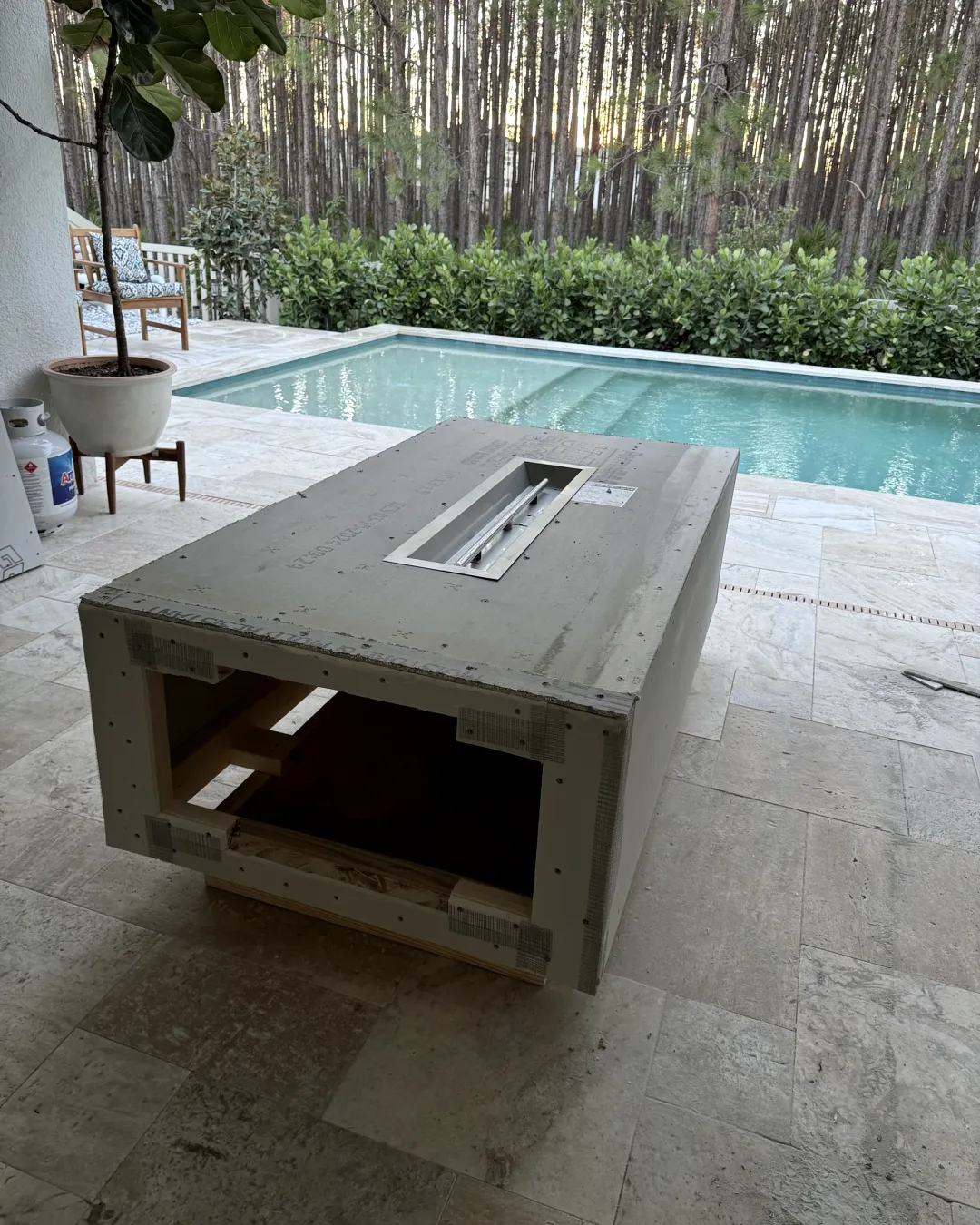 The burner installed in the top, the sides taped and ready to finish